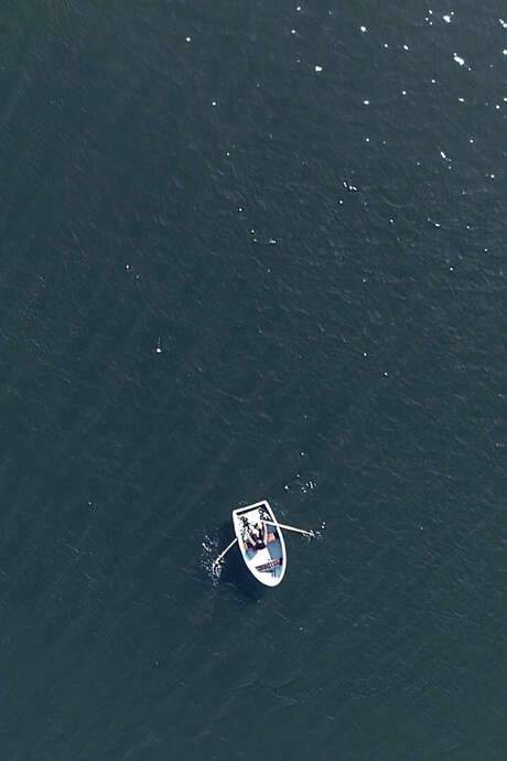 This video follows artist Coco Fusco on a boat journey around Hart Island, New York’s public cemetery. Operated by the city’s Department of Corrections until 2021, the island has been the burial site for over a million New Yorkers since 1869, with prisoners historically performing the burials in mass graves. Many were buried anonymously, particularly during outbreaks. The video incorporates a poetic meditation written by Fusco and performed by Pamela Sneed, reflecting on the conditions of the recent pandemic.